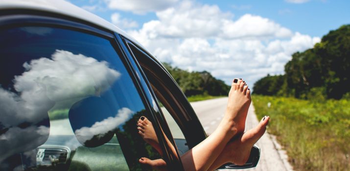 Feet outside car door while driving Feet outside car door while driving